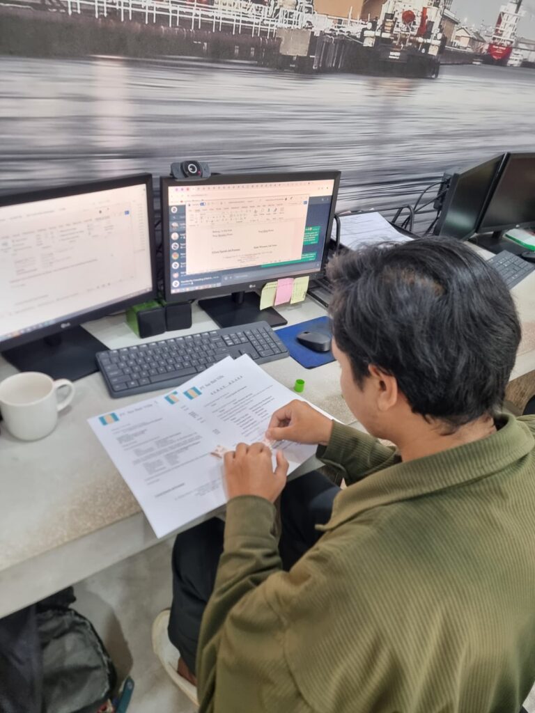 TraceWorthy team member reviewing Indonesian permit administration documents