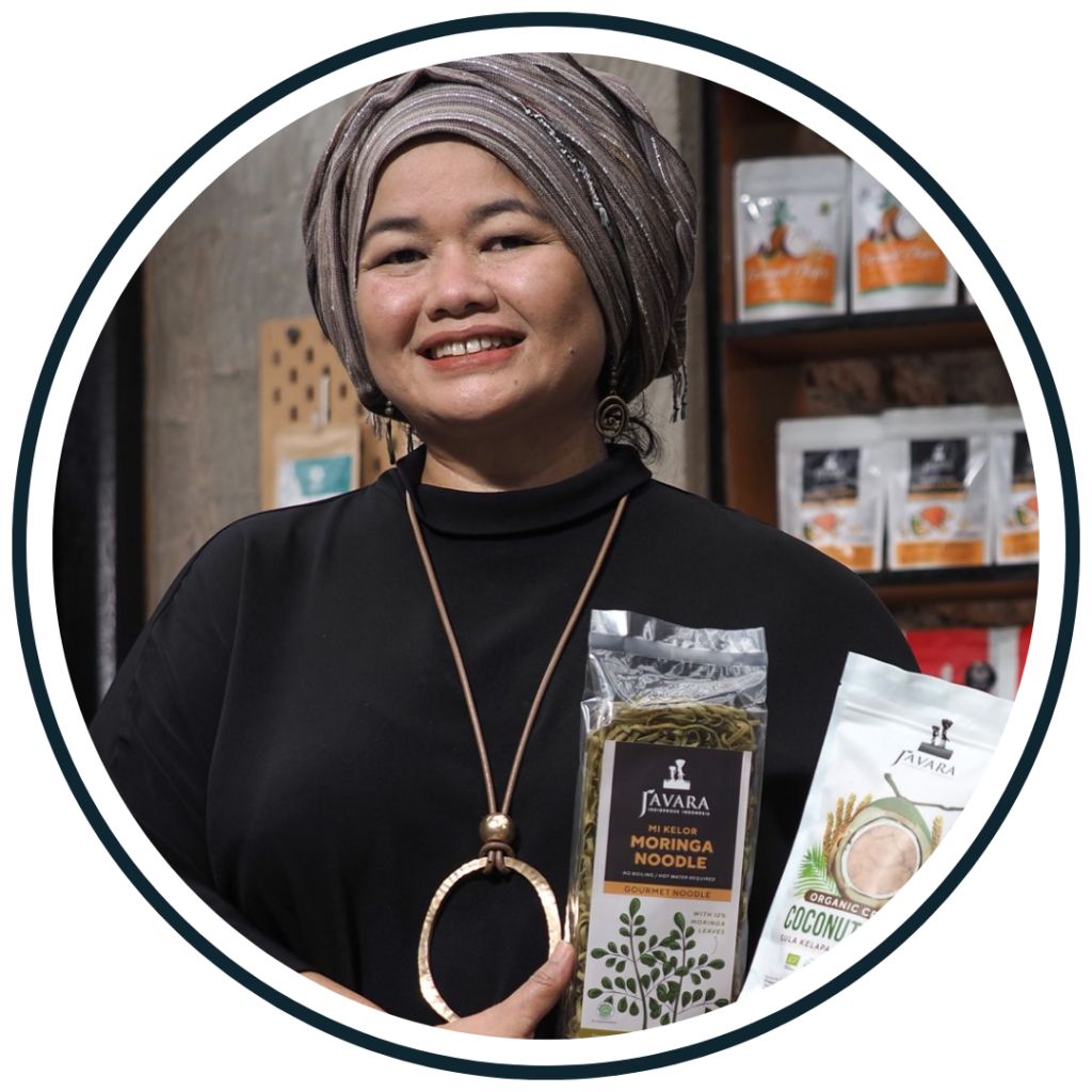 Helianti Hilman, founder of Javara, holding indigenous-food products, illustrating a social enterprise built as a company in Indonesia.