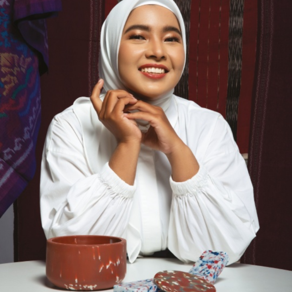 Syukriyatun Niamah, founder of Robries, with recycled-plastic homeware, illustrating a micro venture formalised into a registered studio in Indonesia.